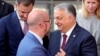 Hungarian Prime Minister Viktor Orban (right) recently wrote to European Council President Charles Michel (left) asking for a "strategic discussion" on the EU's approach to Ukraine in a number of fields.