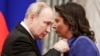 RUSSIA – Russia's President Vladimir Putin (L) awards an Order of Honour to RT and Rossiya Segodnya editor-in-chief Margarita Simonyan during a ceremony at the Moscow Kremlin, December 20, 2022