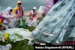 Marking a holiday, Dukhobors, dressed in their traditional finery, enjoy a picnic in the mountains of Javakheti.