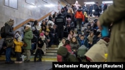 People shelter inside a subway station during massive Russian missile attacks on Kyiv on December 16. 