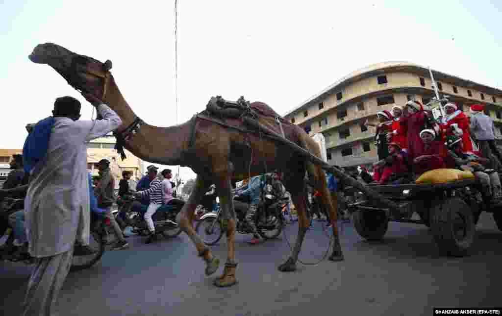 Members of the Pakistani Christian minority take part in a parade ahead of Christmas, in Karachi, Pakistan, on December 11.