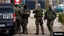 KFOR soldiers patrol in North Mitrovica, Kosovo, on December 13.