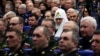 Patriarch Kirill, head of the Russian Orthodox Church, sits among military officers at an annual meeting of the Russian Defense Ministry Board in Moscow in December 2022. 