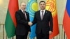 Russian President Vladimir Putin (left) shakes hands with Kyrgyz counterpart Sadyr Japarov at a meeting of the Supreme Eurasian Economic Council in Bishkek on December 9.