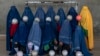An Afghan women's soccer team poses for a photo in Kabul in September 2022.