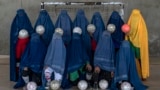 An Afghan women's soccer team poses for a photo in Kabul in September 2022.