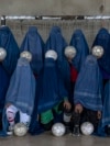 An Afghan women's soccer team poses for a photo in Kabul in September 2022.