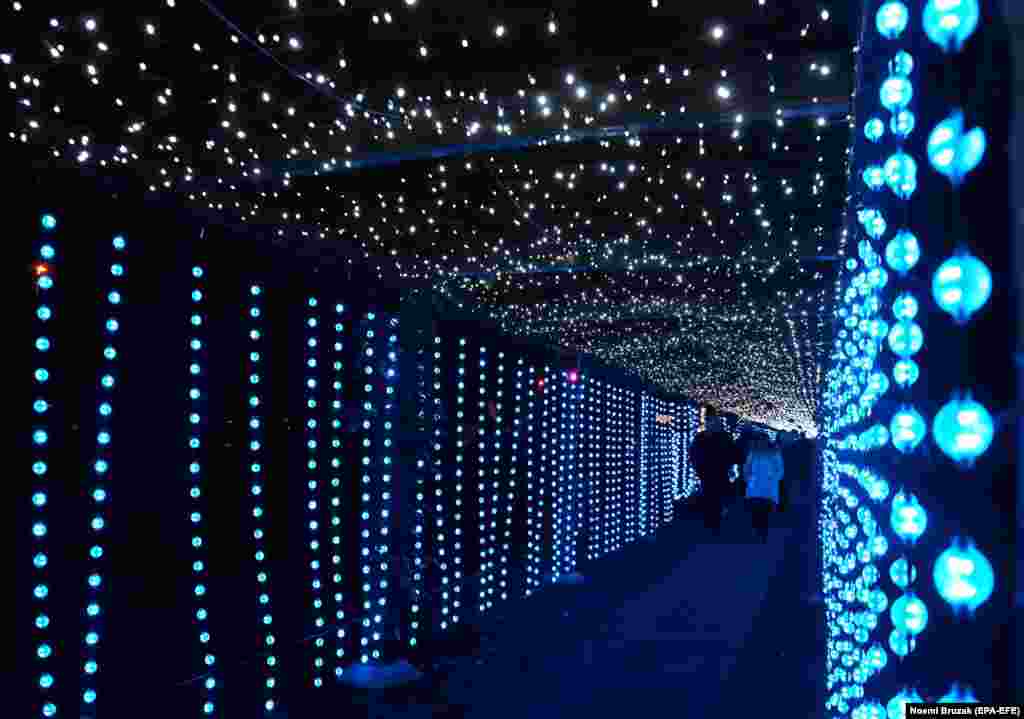 Visitors walk inside a light installation in Lumina Park, created in the Palatinus open-air baths area on Margaret Island, in Budapest on December 27.