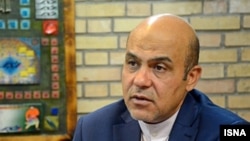 Iran -- Alireza Akbari, former employee of the Ministry of Defense of Iran who has been accused of espionage