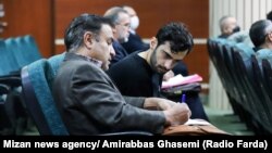 Iranian actor Hossein Mohammadi, pictured in court on December 15, was charged with killing Basij militia member Ruhollah Ajamian and sentenced to death in a revolutionary court.