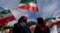  Protesters wave Iranian flags during a rally in front of the Reichstag building in Berlin. During the current wave of unrest, Iranian security forces have taken some 40 foreign nationals into custody, often without revealing any charges.