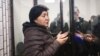 Klara Sooronkulova speaks to journalists while detained at a court in Bishkek on December 13.