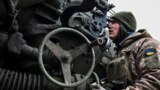 UKRAINE – A Ukrainian service member prepares to shoot from a howitzer at a front line, as Russia's attack on Ukraine continues, in Zaporizhzhia Region, December 16, 2022