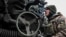 UKRAINE – A Ukrainian service member prepares to shoot from a howitzer at a front line, as Russia's attack on Ukraine continues, in Zaporizhzhia Region, December 16, 2022