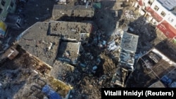 An aerial view shows a local market heavily damaged by a Russian missile strike in the town of Shevchenkove, Kharkiv region, on January 9.