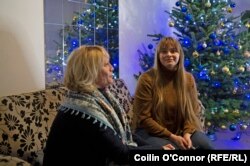 Olena Bezzubenko (left) and her daughter, Vira, in the lobby of the Prague hotel they recently moved out of after staying there for months following the start of Russia's invasion of Ukraine.