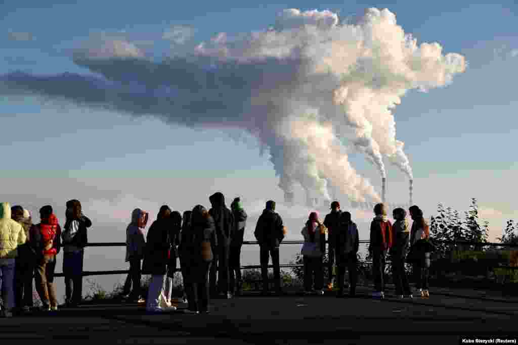 People watch steam and smoke billow from the Belchatow Power Station in Zlobnica, Poland on October 20. In September Jarosław Kaczynski, the leader of Poland&rsquo;s Law and Justice party, declared: &quot;We should be burning everything, other than tires or similar things... Put simply, Poland needs to be heated.&quot;