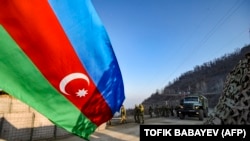 Nagorno-Karabakh - Russian peacekeepers are seen deployed at a section of the Lachin corridor blocked by Azerbaijan, December 26, 2022.