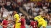 جریان مسابقه فوتبال میان تیم های قطر (لباس سرخ) با اکوادور 