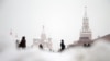 RUSSIA WEATHER SNOWFALL -- People walk on the Red Square in front of Moscow Kremlin during a snowfall in downtown Moscow, Russia, 28 December 2022