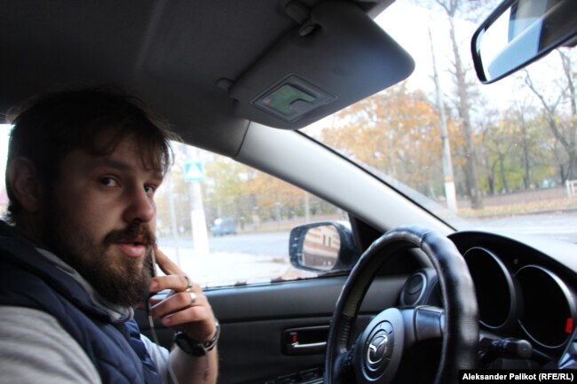 Mykhaylo in his taxi