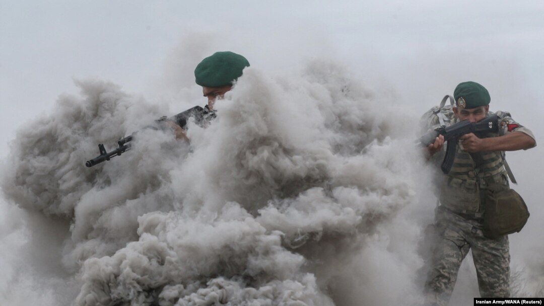 Members of the Iranian Army take part in an annual drill in the coastal area of the Gulf of Oman and near the Strait of Hormuz on December 30.