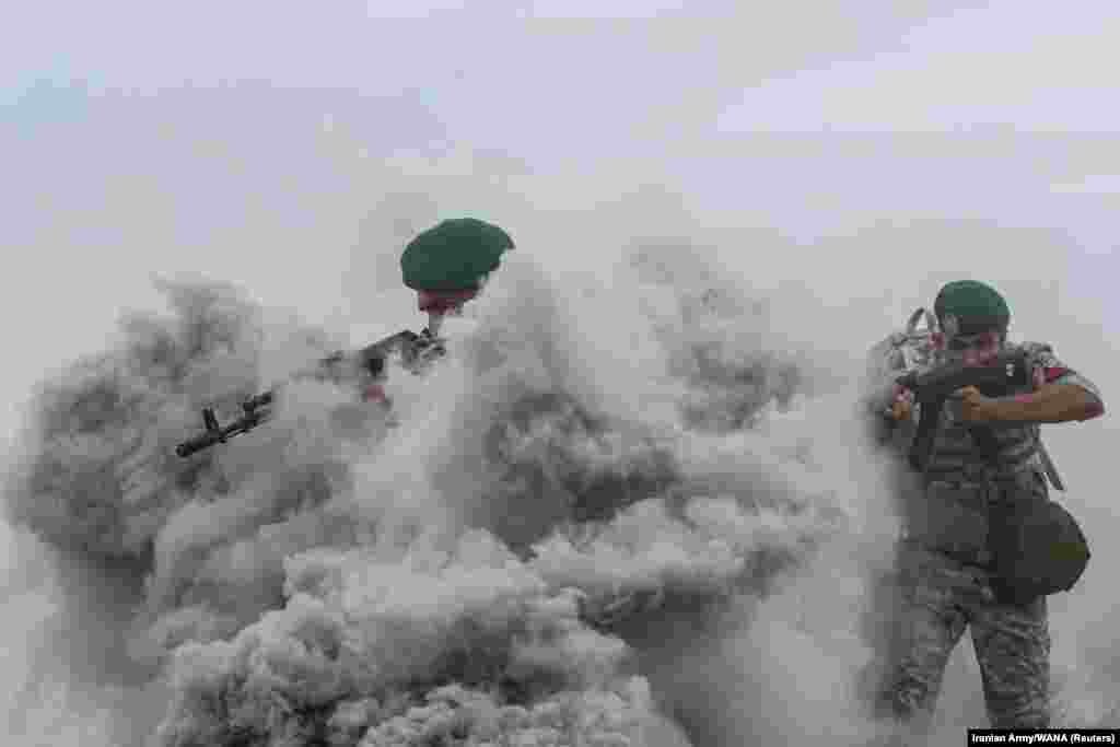 Members of the Iranian Army take part in an annual drill in the coastal area of the Gulf of Oman and near the Strait of Hormuz on December 30.