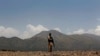 A Pakistani soldier stands guard near along the Afghan border. (file photo)