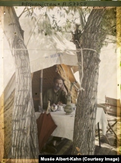 Engineer H. Sassey, whose nationality is not specified, at the entrance to his tent during a surveying mission for the Afghanistan Railways Survey in 1928. Early 20th-century attempts to establish major rail connections across Afghanistan were abandoned, largely due to civil unrest.