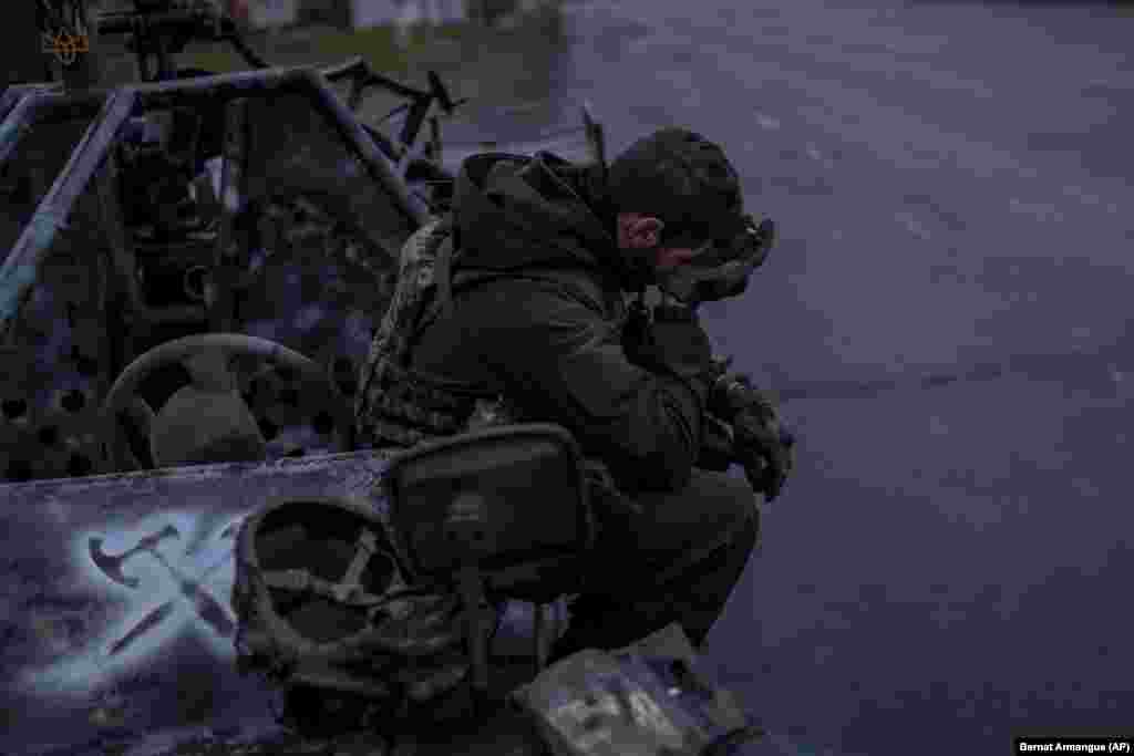 A Ukrainian serviceman pauses after coming back from the front line near Kherson, southern Ukraine.