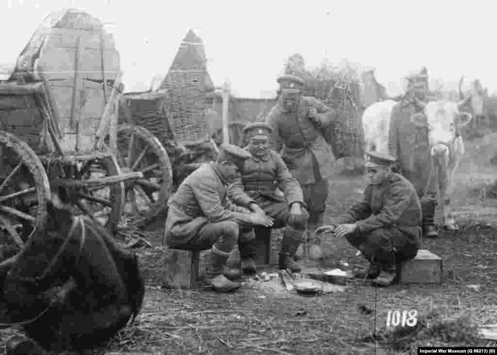 Bulgarian troops gather around a fire during a rest between marches at an unknown location in February 1917.