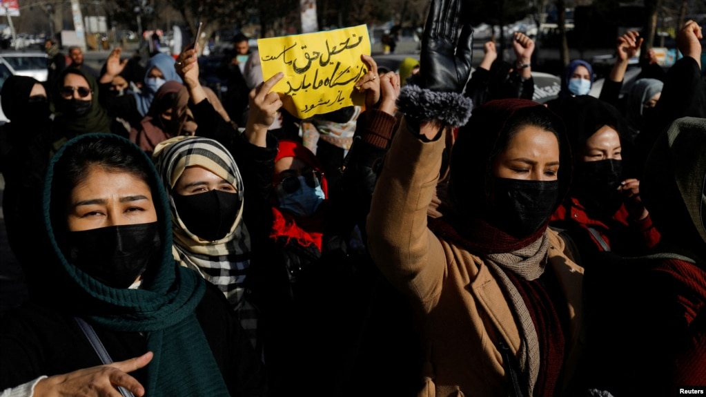 Afghan women chant slogans in protest at the closure of universities to women by the Taliban in Kabul in December 2022.