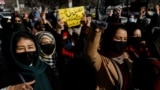 Afghan women chant slogans in protest at the closure of universities to women by the Taliban in Kabul in December 2022.