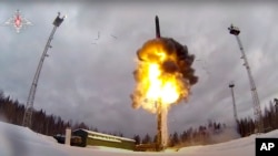 This photo taken from video provided by the Russian Defense Ministry on February 19, 2022, shows a Yars intercontinental ballistic missile being launched from an air field during military drills.