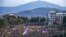 Nagorno-Karabakh - Protesters hold a giant Armenian flag as they attend a rally in Stepanakert on December 25, 2022.