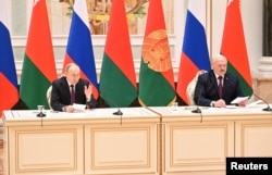 Владимир Путин и Александр Лукашенко в Минске на пресс-конференции. 19 декабря 2022 года