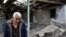 NAGORNO-KARABAKH - A man walks in the yard of his brother's house damaged by shelling during fighting between Armenia and Azerbaijan over the breakaway Nagorno-Karabakh region, in the disputed region's city of Martuni , October 1, 2020