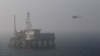 A helicopter lands on an oil platform in the Caspian Sea, east of Baku, January 22, 2013
