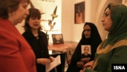 Catherine Ashton (L), the European Union's top foreign policy diplomat, at a meeting with Narges Mohammadi (right), an Iranian human rights activist and mother of Sattar Beheshti, who died in Iranian custody.