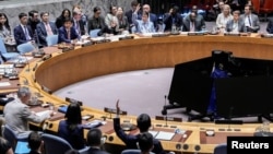Members of the UN Security Council vote on a resolution by Russia and China to delay reimposition of sanctions on Iran on September 26. The resolution failed. 