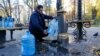 In Kyiv, as a result of Russian shelling of infrastructure, the water supply has disappeared in many areas of the city. Here, people collect water near one of the pumping stations in the central part of the city on October 31.