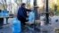 In Kyiv, as a result of Russian shelling of infrastructure, the water supply has disappeared in many areas of the city. Here, people collect water near one of the pumping stations in the central part of the city on October 31.