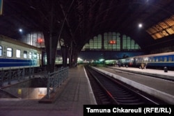 The train carriages separate at the train station in Lviv.