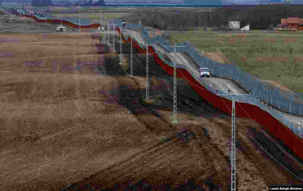 A Hungarian police van patrols the Hungary-Serbia border, which was fortified by a second fence, near the Hungarian village of Gara in March 2017. According to a recent report from Statista, more than half of EU member states now have border barriers in place.&nbsp; &nbsp;