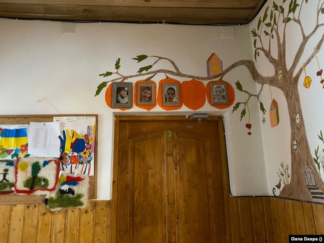 Framed photos above the doors have helped the children become familiar with where their bedrooms are located.