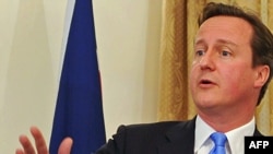 British Prime Minister David Cameron speaks at a news conference in Kabul on June 10.