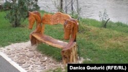 Self-taught sculptor Golub Milanovic carves wooden benches