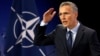 Jens Stoltenberg addresses a news conference at NATO headquarters in Brussels on June 28.