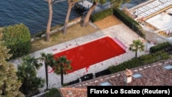 The swimming pool of a villa owned by Vladimir Solovyov was colored red after being vandalized near Lake Como.