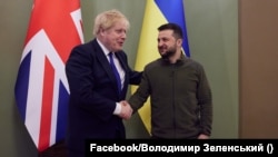 British Prime Minister Boris Johnson (left) shakes hands with Ukrainian President Volodymyr Zelenskiy in Kyiv on April 9.